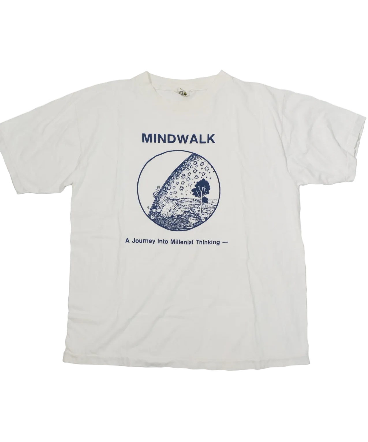 A white short-sleeve t-shirt with a blue graphic print on the front. The graphic features the text 'MINDWALK' above a circular illustration of a person shoving their head through a star covered surface with a tree and river in the background  and the subtitle 'A Journey Into Millenial Thinking'.
