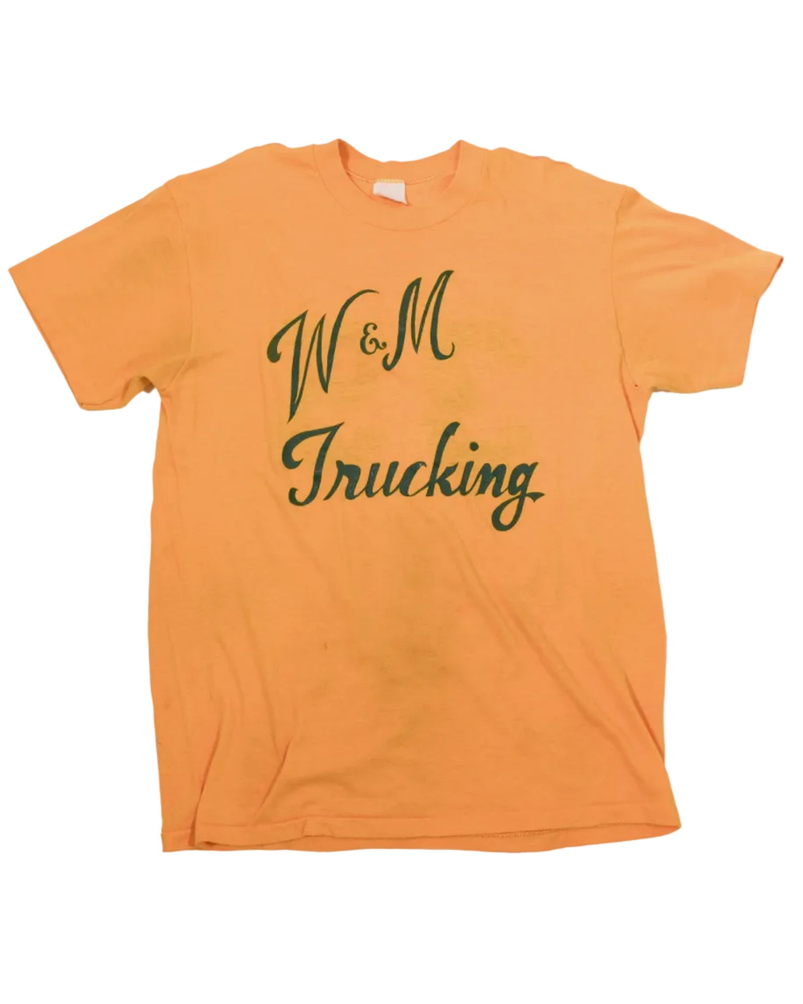An orange yellow short-sleeve crewneck t-shirt with 'W&M Trucking' printed in dark green cursive text across the chest, laid flat against a white background.